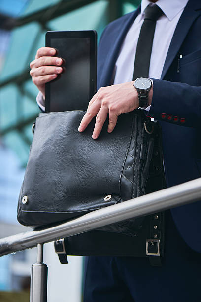istock Male hand put the tablet in a portfolio 531774366