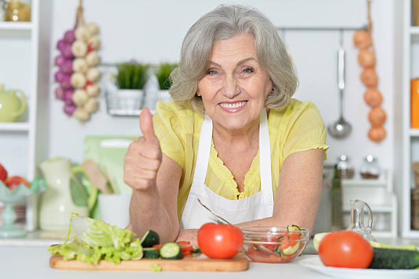 istock Senior woman cooking in kitchen 531775026