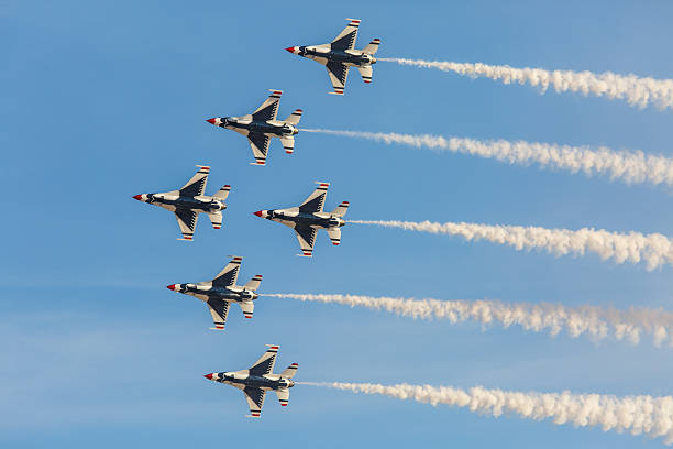 USAF Thunderbirds perform air show routine Las Vegas, USA - November 8, 2014: USAF Thunderbirds perform air show routine during Aviation Nation at Nellis AFB on November 8,2014 in Las Vegas,NV. Squadron is the official air demonstration team for the USAF.  supersonic airplane editorial airplane air vehicle stock pictures, royalty-free photos & images