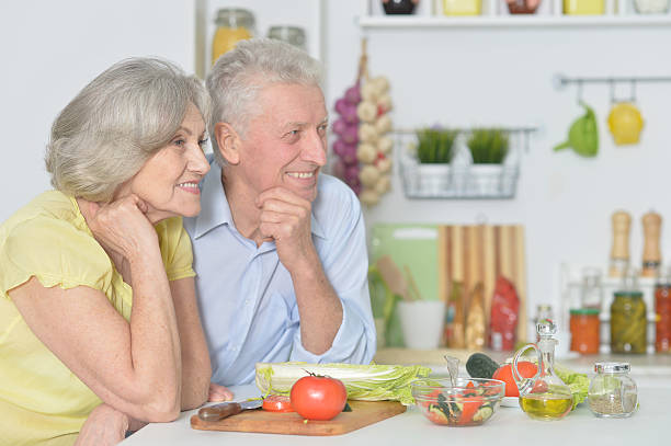 istock senior man and woman  in the kitchen 531775414
