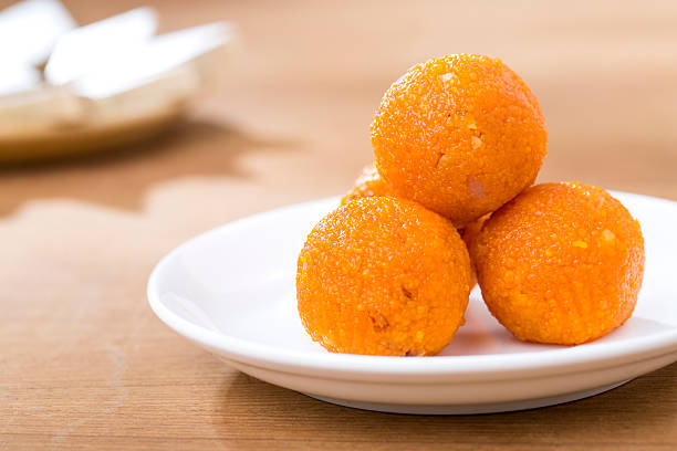 Orange Indian sweets Motichoor Laddu or Laddoo Pile of orange Indian sweets Motichoor Laddu or Laddoo india sweets stock pictures, royalty-free photos & images