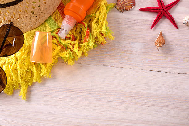 istock Beach accessories and tourism prepared on brown wood table top 531778764