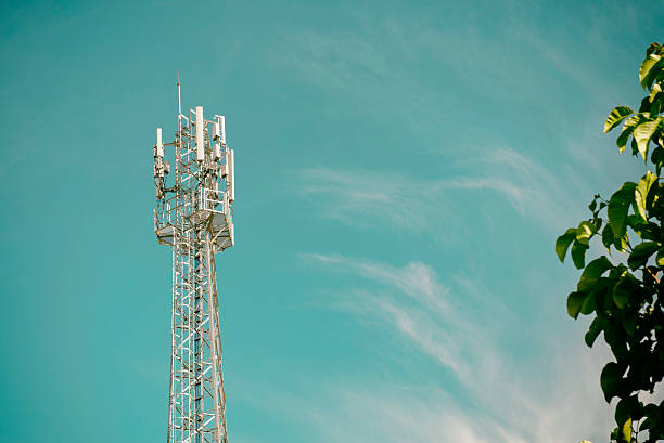 GSM cell transmission station and summer landscape with cloudy s stock photo