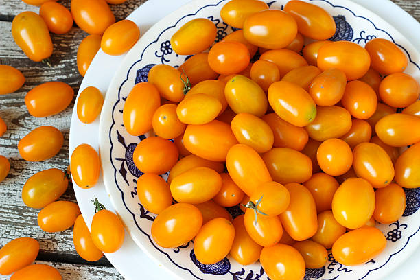 istock Mini yellow cherry tomatoe in white dish 531784888