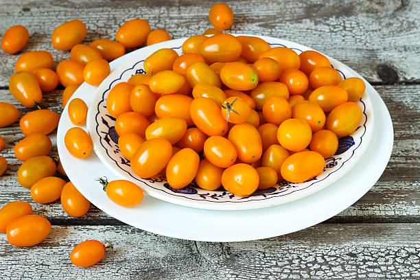 istock Mini yellow cherry tomatoe in white dish 531784992