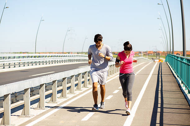 istock Young sport couple running together 531785534