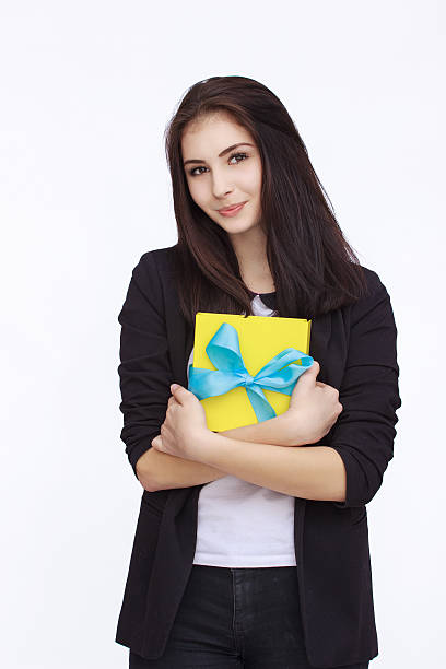 istock Young woman portrait holding gift 531785870