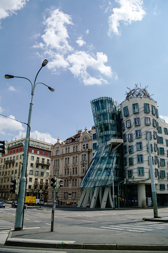 Prague, Czech Republic - May 8, 2012: Modern building, also known as the Dancing House, designed by Vlado Milunic and Frank O. Gehry stands on the Rasinovo Nabrezi.