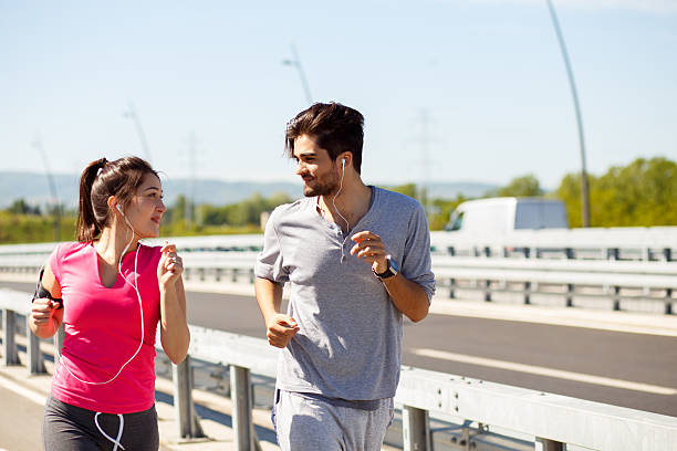 istock Young sport couple running together 531786762