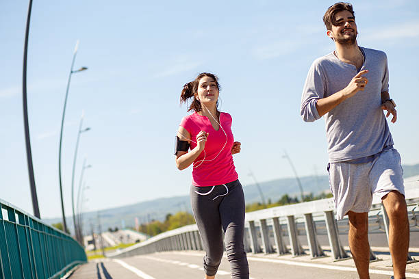 istock Young sport couple running together 531787022