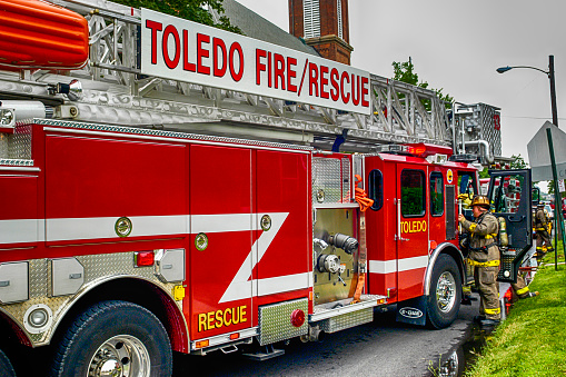 Toledo, OH, USA - July 2, 2006: Firefighters at a house fire in the suburbs of Toledo, Ohio