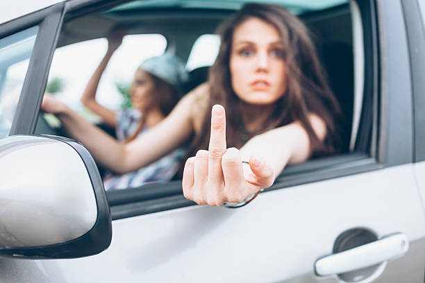 istock Young woman making rude gesture 531788422