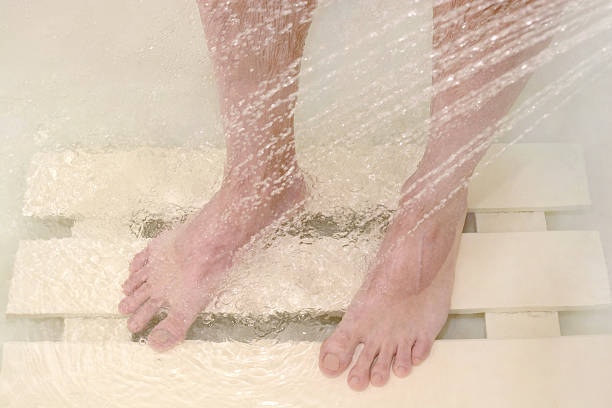 istock man washes his feet in the shower 531788444