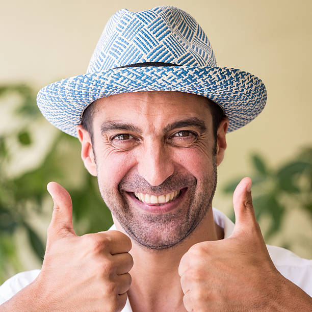 Smiling Mid adult hispanic man in his thirties-forties posing looking at the camera