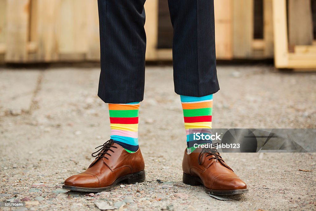 fancy socks man in fancy, rainbow socks Suit Stock Photo