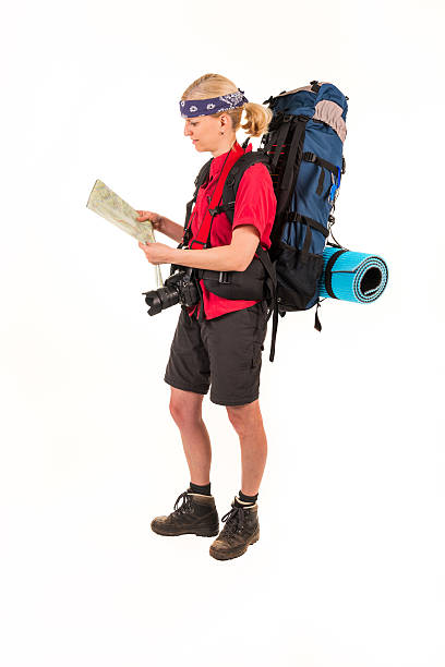 female hiker with big backpack looking at a map