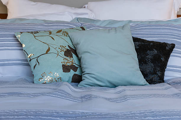 istock blue pillows on bed in hotel room 531791622