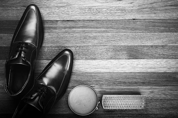Men's dress shoes being shined.