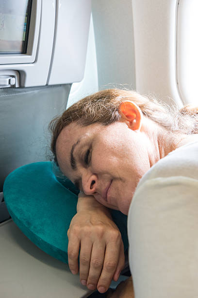 istock Woman Sleeping at the airplane 531792616