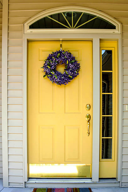 Yellow painted standard 6-panel residential front door