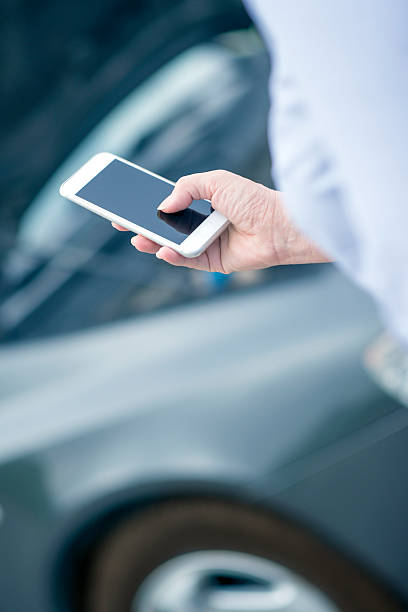 istock Woman using smart phone and call the car insurance 531793010