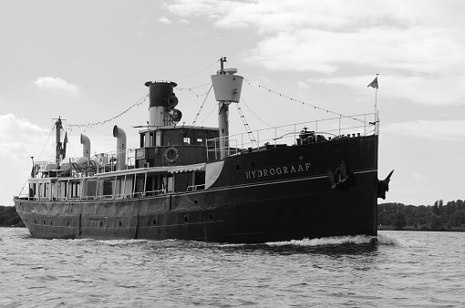 A Western Rivers style sidewheel river excursion steamboat, docked in New Orleans, Louisiana, USA along the Mississippi River. Photo taken in 1953.