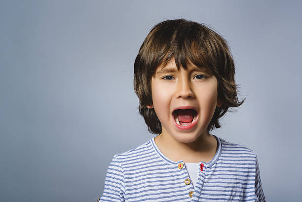 istock Closeup crying boy with worried stressed expression on gray background 531794282