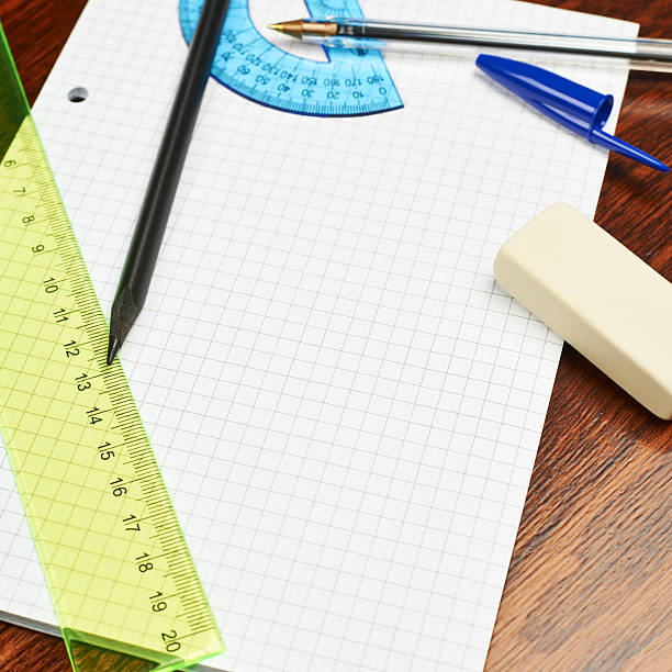 istock Blank sheet of paper covered with writing appliances 531795586