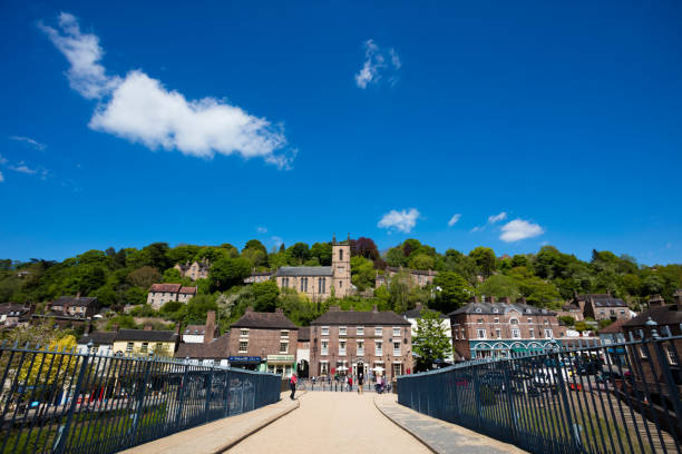 Ironbridge Telford Ironbridge, England - May 16, 2016: An editorial stock photo of Ironbridge in Telford, Shropshire in the united Kingdom. People can be seen wandering the various old buildings and shops at the famous British tourist destination.  ironbridge shropshire stock pictures, royalty-free photos & images