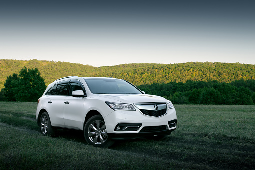 Saratov, Russia - August 11, 2015: Car Acura MDX is parked at the countryside at sunset