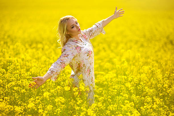 istock Beautiful woman in spring field 531796138
