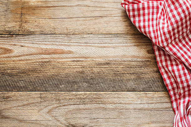 Wooden background with textile and copy space for text Wooden background with textile / Cooking food / pizza wooden table background with red and white textile. Copy space for text checked pattern photos stock pictures, royalty-free photos & images