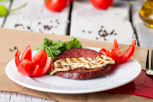 Turkish Ottoman Sausage on the White plate rustic background