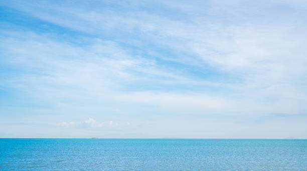 istock Blue sea on sunny, cloudy sky background 531797488