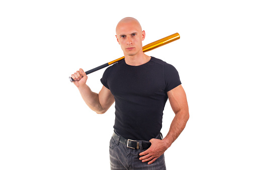 Violence and aggression concept - furious screaming angry man hand holding baseball sport bat in black t-shirt