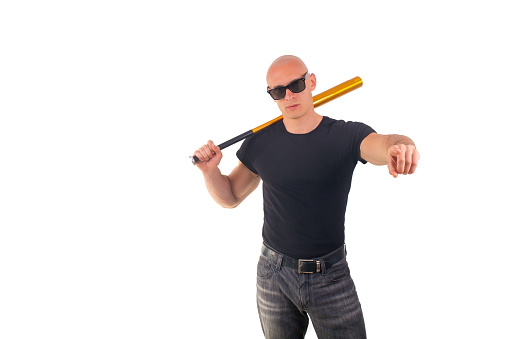 Violence and aggression concept - furious screaming angry man hand holding baseball sport bat in black t-shirtViolence and aggression concept - furious screaming angry man hand holding baseball sport bat in black t-shirt
