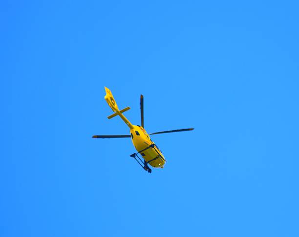 istock flying rescue helicopter in sky background 531800300