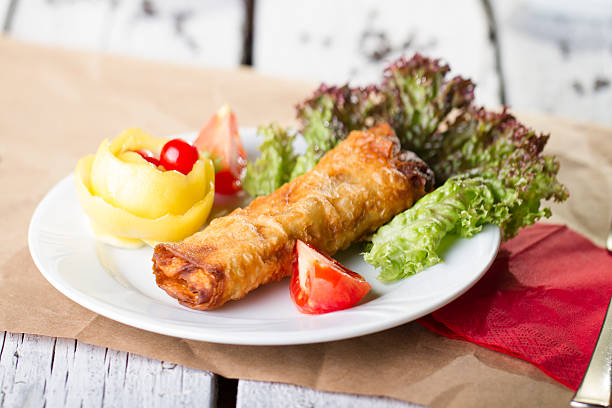 Deep fried phyllo pastry with pastrami and tomato filling