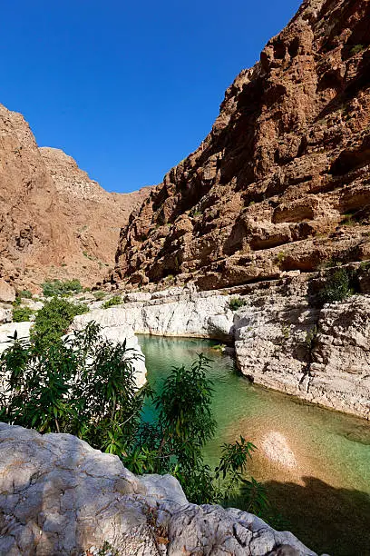 famous wadi shab river valley in oman.