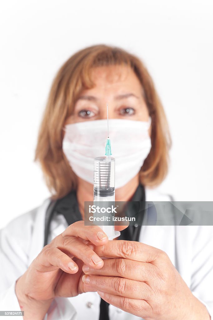 Healthcare Doctor holding syringe Adult Stock Photo