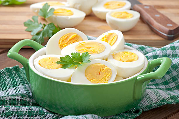 istock Boiled eggs in a bowl decorated with parsley leaves 531824797
