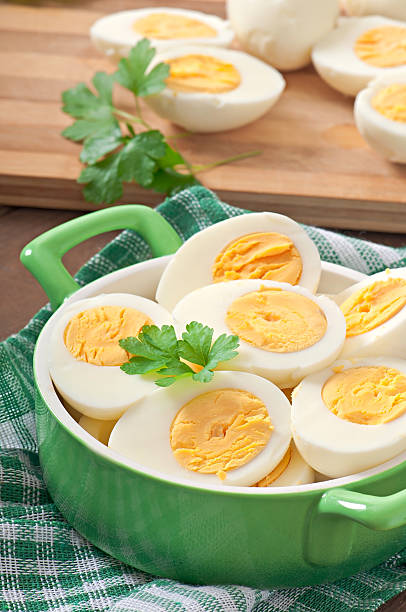 istock Boiled eggs in a bowl decorated with parsley leaves 531824803