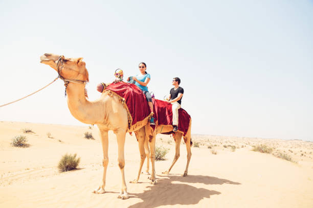 tourists riding through the desert