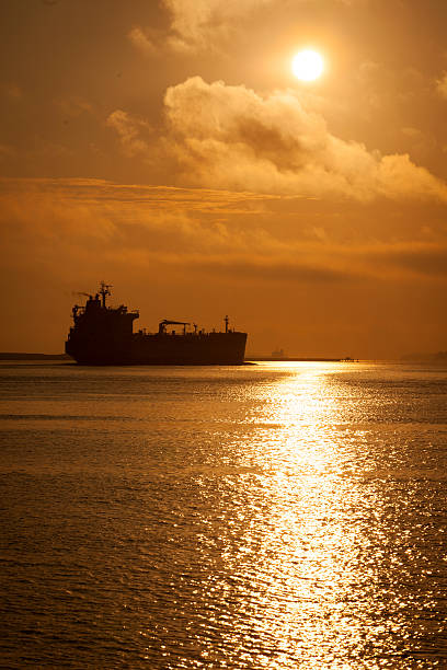 istock Tanker leaving Boston harbor at sunrise 531829371
