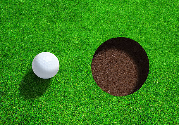 istock Golf Ball Close to Hole With Copy Space. Top View. 531842028