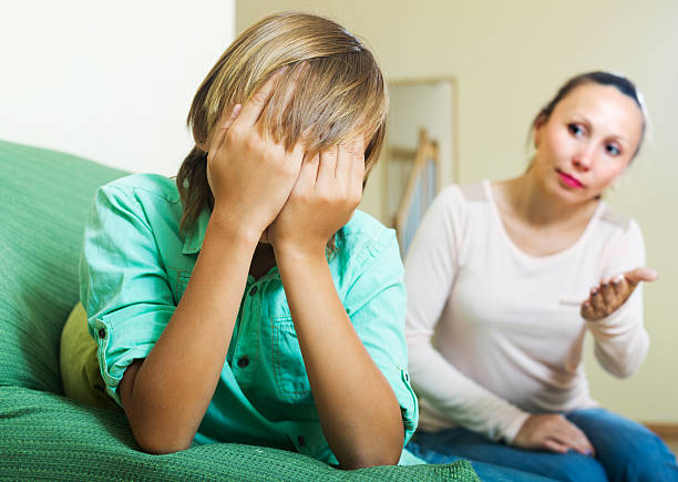 istock Mother berating teenager son 531842923