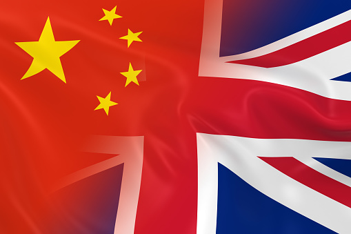Chinese and British Relations Concept Image - Flags of China and the United Kingdom Fading Together