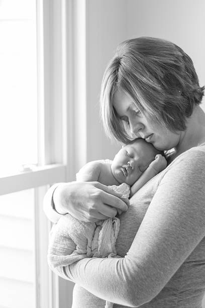 istock Mother embracing newborn baby 531844419
