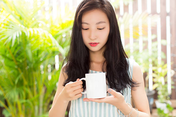 istock girl sitting on a bamboo weaving chair 531846082