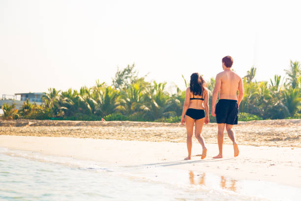istock tourists walking on the beach 531848179